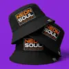Три чёрные панамы NEON SOUL стопкой на фиолетовом фоне — виден фронтальный принт Electric Orange