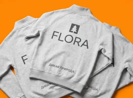 Три серые толстовки FLORA внахлест, крупный логотип на спинке, оранжевый фон